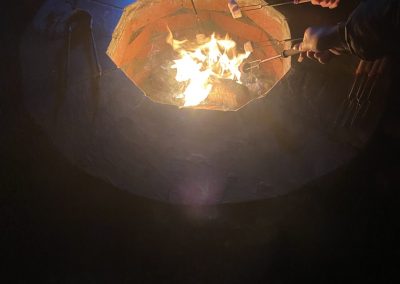 Toasting marshmallows around the fire pit